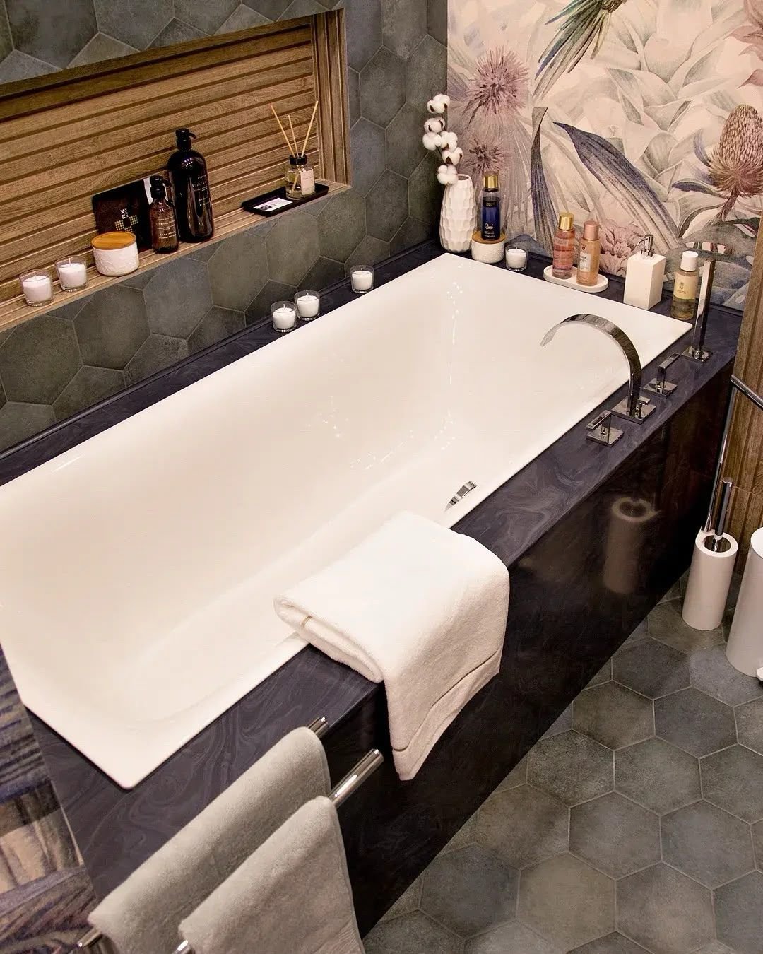 Free-standing bathtub against botanical print wallpaper, Dubai