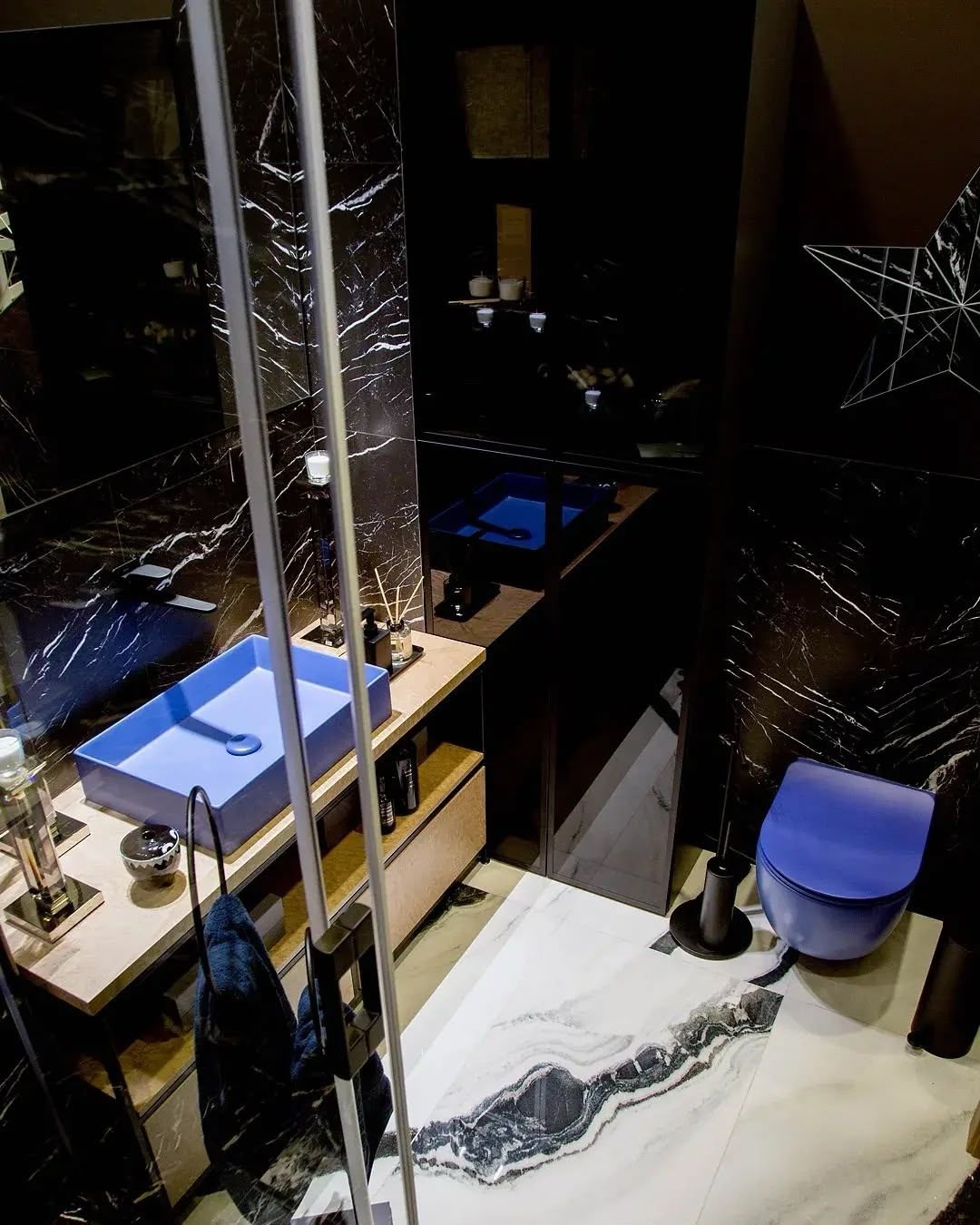 Bathroom overhead view of timber vanity and black marble surround, Dubai