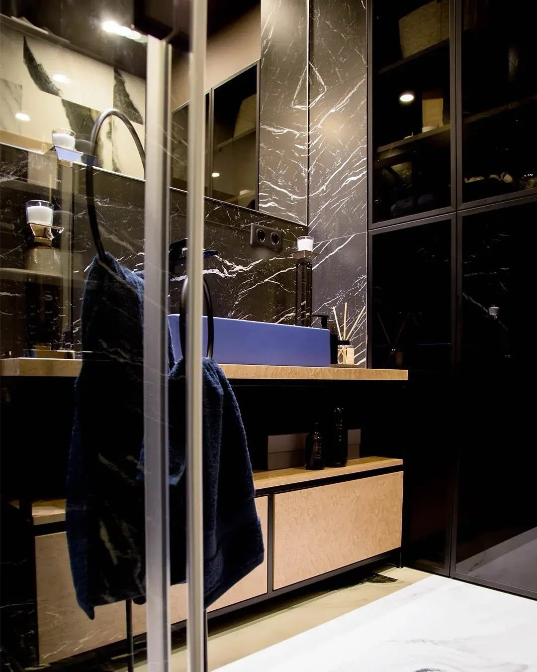 En-suite bathroom with timber vanity and black marble surround, Dubai