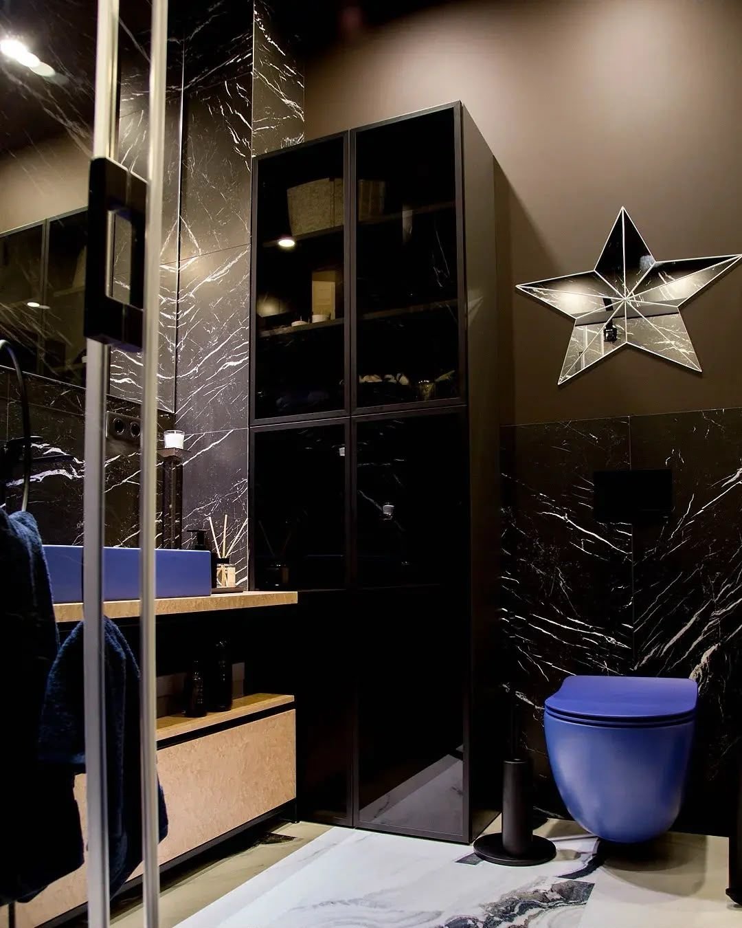 Black marble bathroom with blue sanitaryware, Dubai