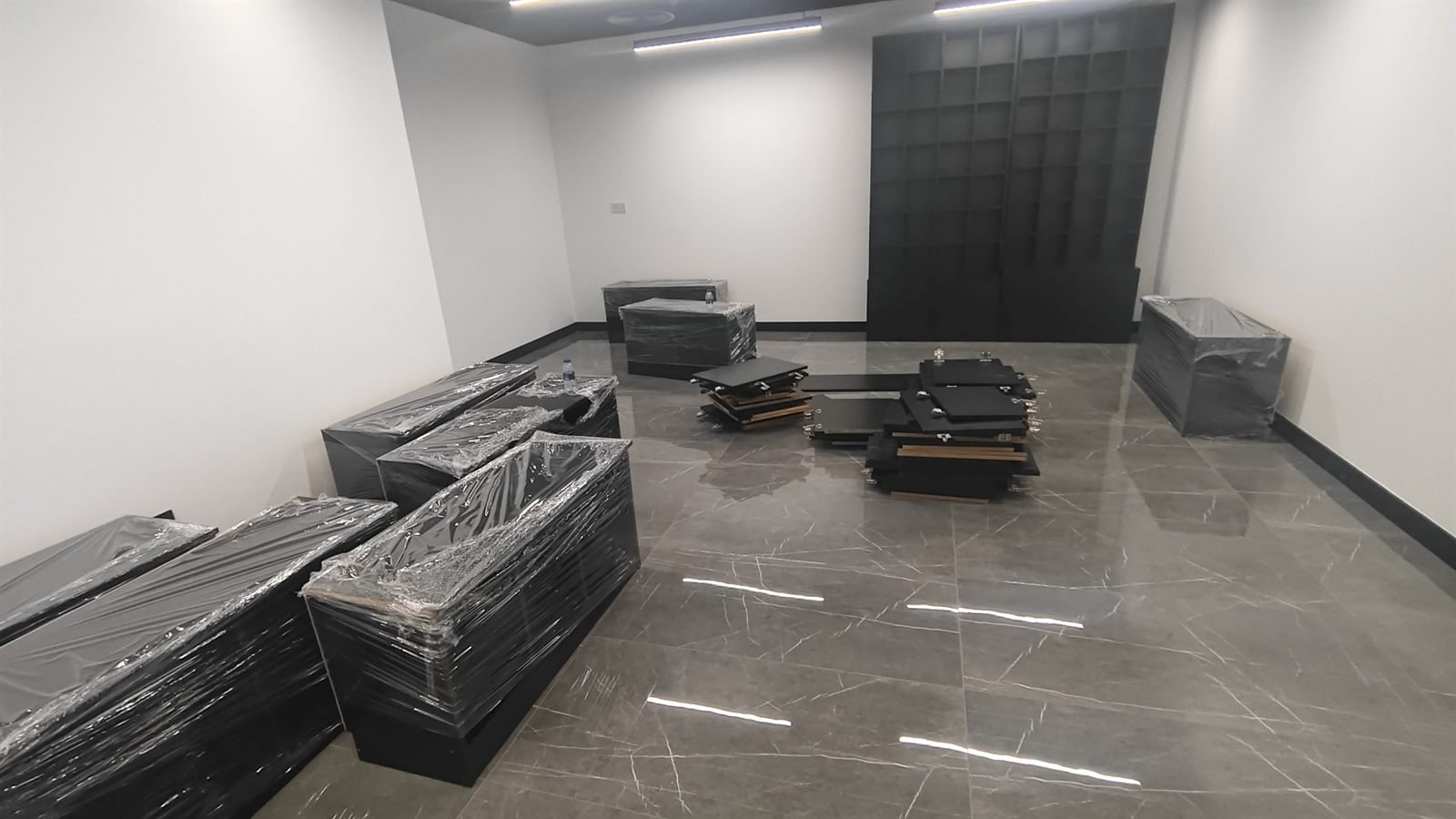 Shelving components staged on site for installation, Dubai