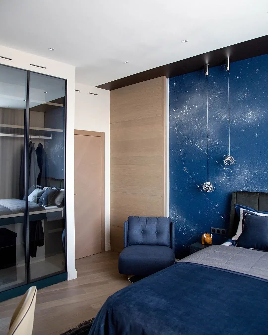 Blue bedroom with mirrored fitted wardrobe, Dubai