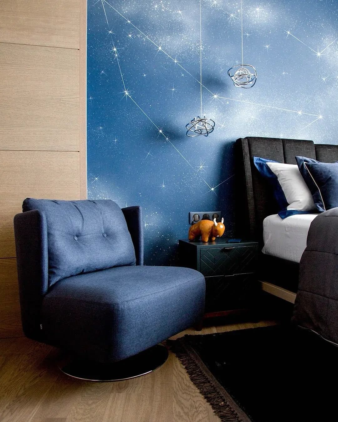 Blue bedroom with fitted joinery and upholstered feature wall, Dubai