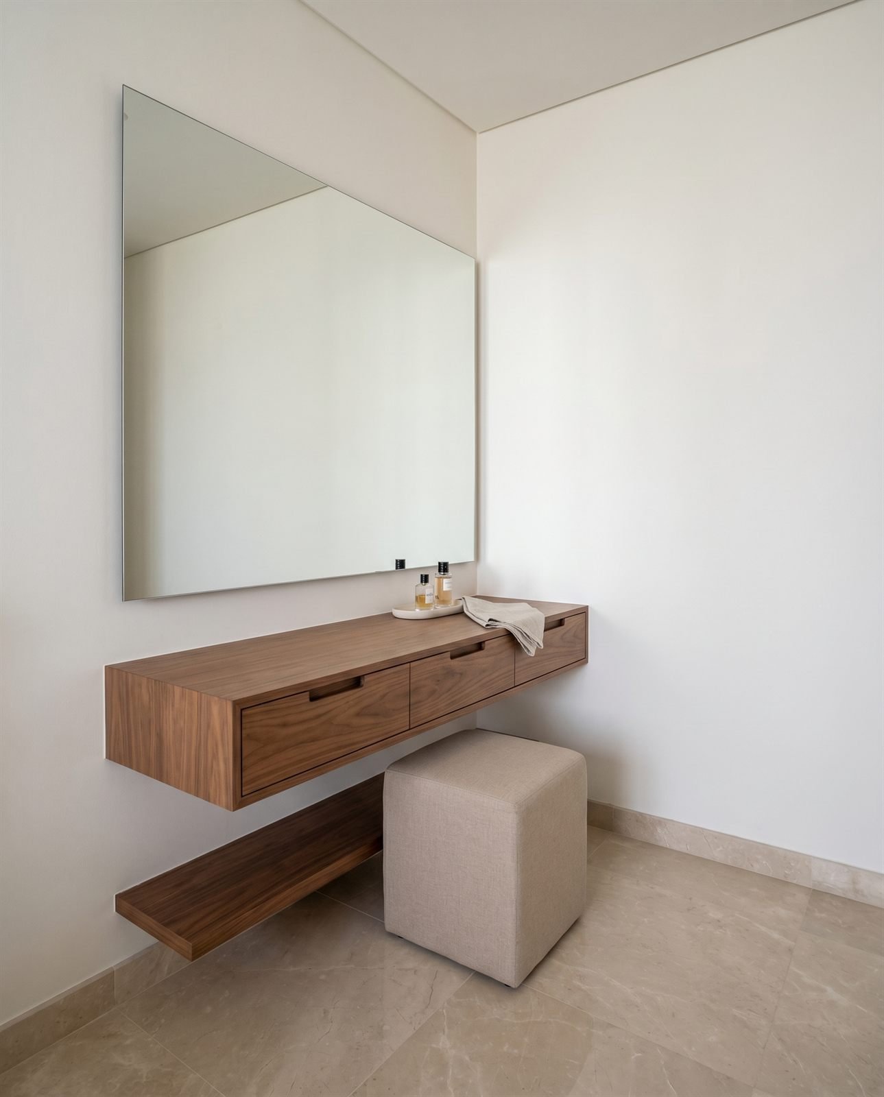 Built-in walnut dressing table with mirror and drawer bank, Dubai