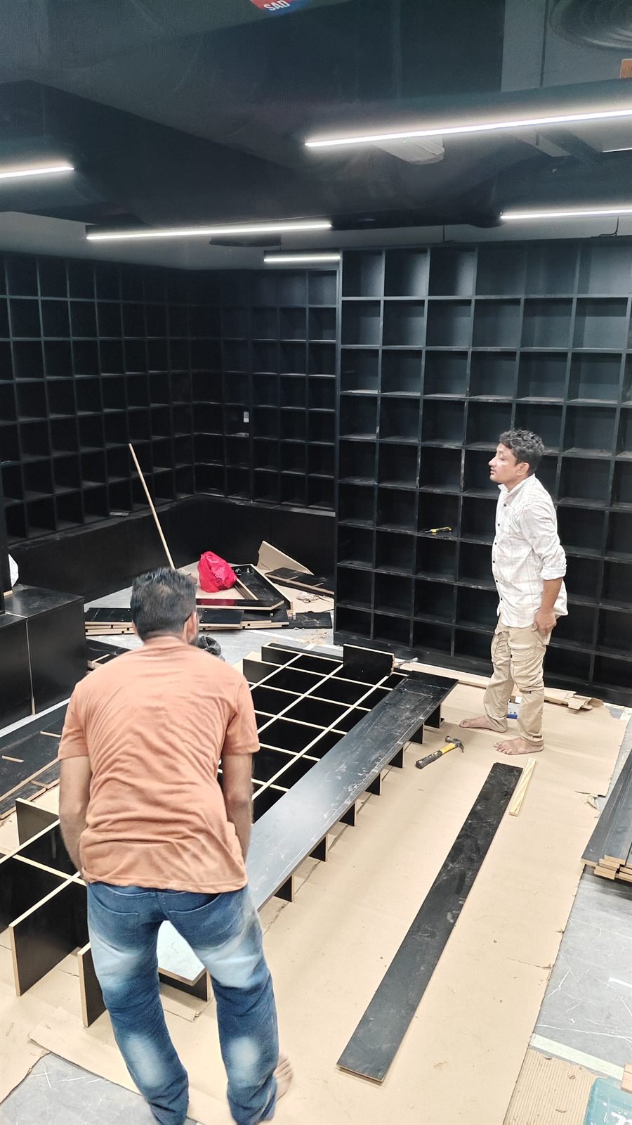 Carpenters building display shelving on site, Dubai