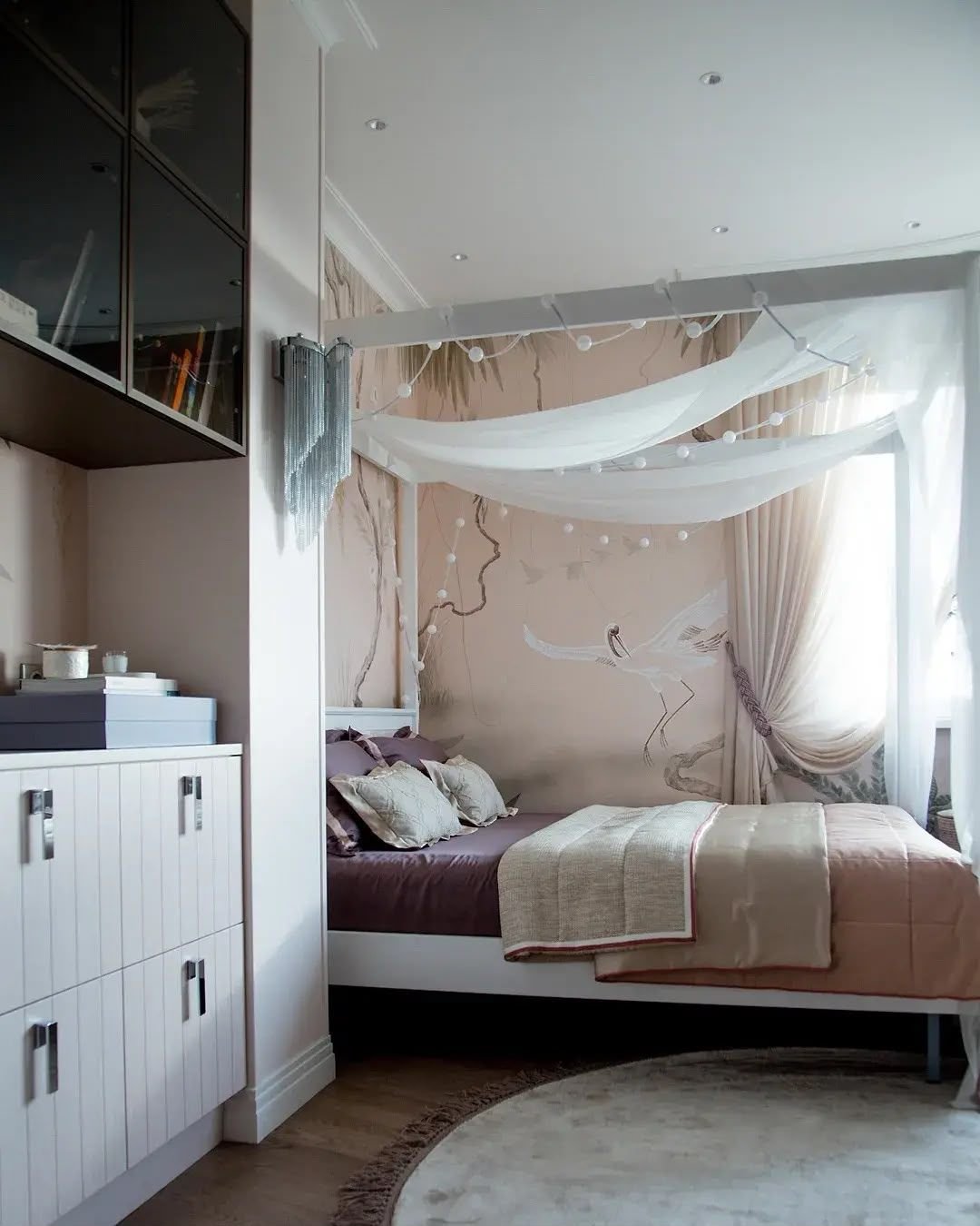 Girl's bedroom with canopy bed and built-in bedside joinery, Dubai