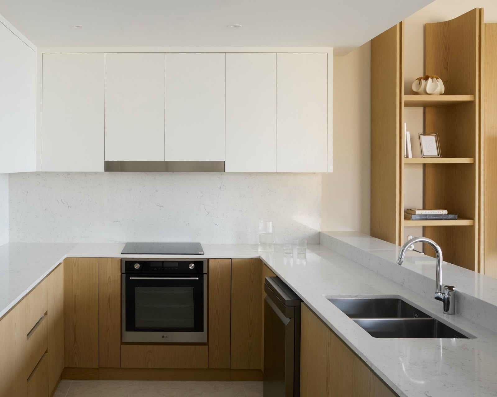 L-shaped kitchen in white cabinetry with oak accents, Dubai