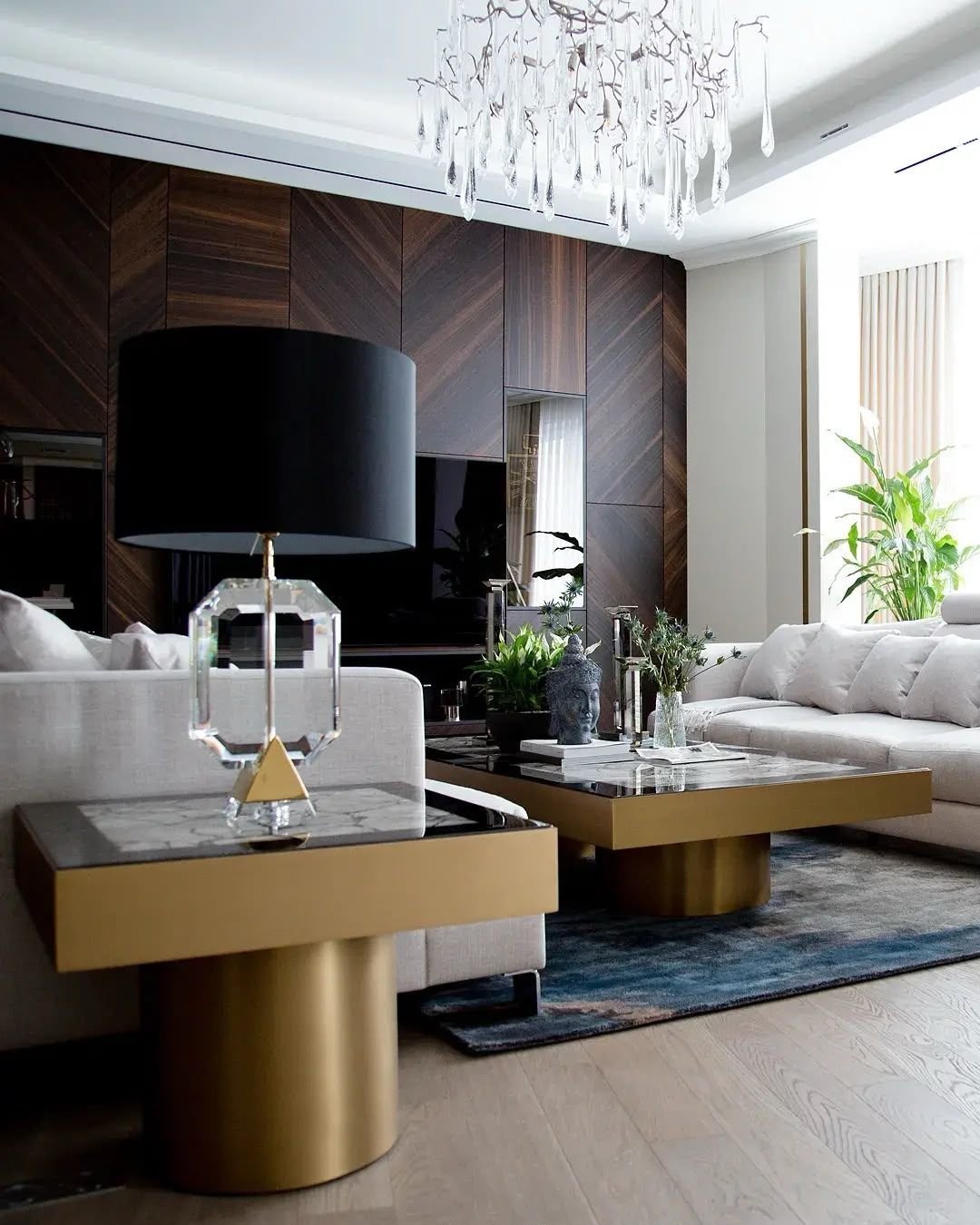 Living-room media wall in chevron dark walnut veneer, Dubai