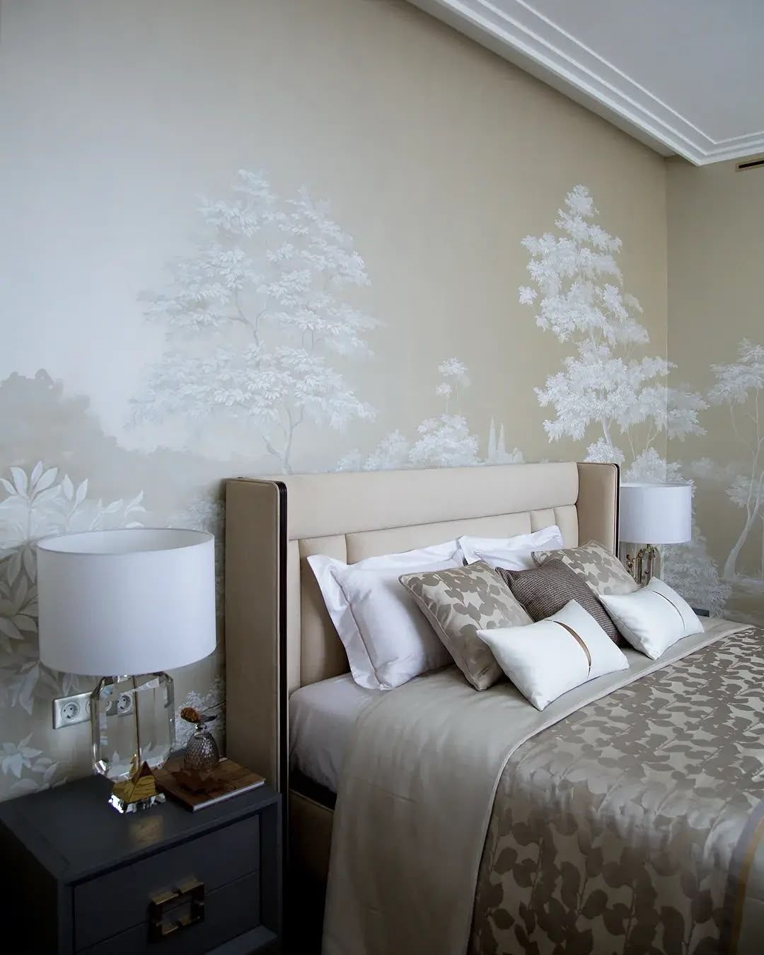 Neutral bedroom with painted mural wall and bedside joinery, Dubai
